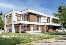 Nowoczesny, energooszczędny dom jednorodzinny z dużymi oknami i drewnianymi elementami, otoczony zielenią, idealny dla rodzin poszukujących komfortu i funkcjonalności.